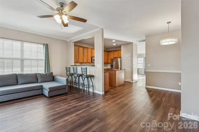a living room with furniture fireplace and window