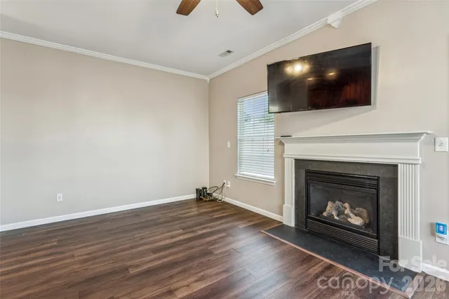 a kitchen with sink cabinets and wooden floor