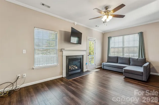 a view of room with wooden floor