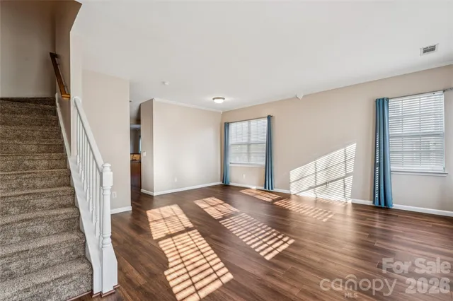 a view of a room with a ceiling fan