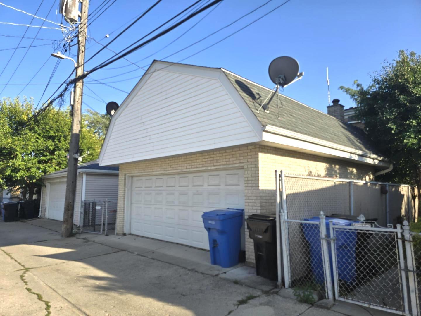 6614 West Devon Avenue Chicago, IL 60631 - Photo 20 of 21 a backyard of a house with seating space
