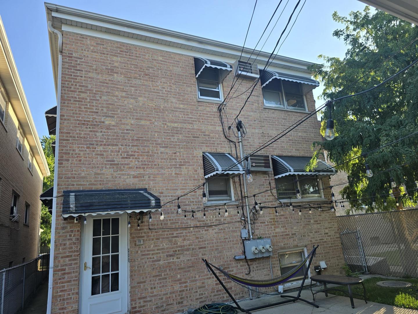 6614 West Devon Avenue Chicago, IL 60631 - Photo 2 of 21 a view of a patio in front of a house