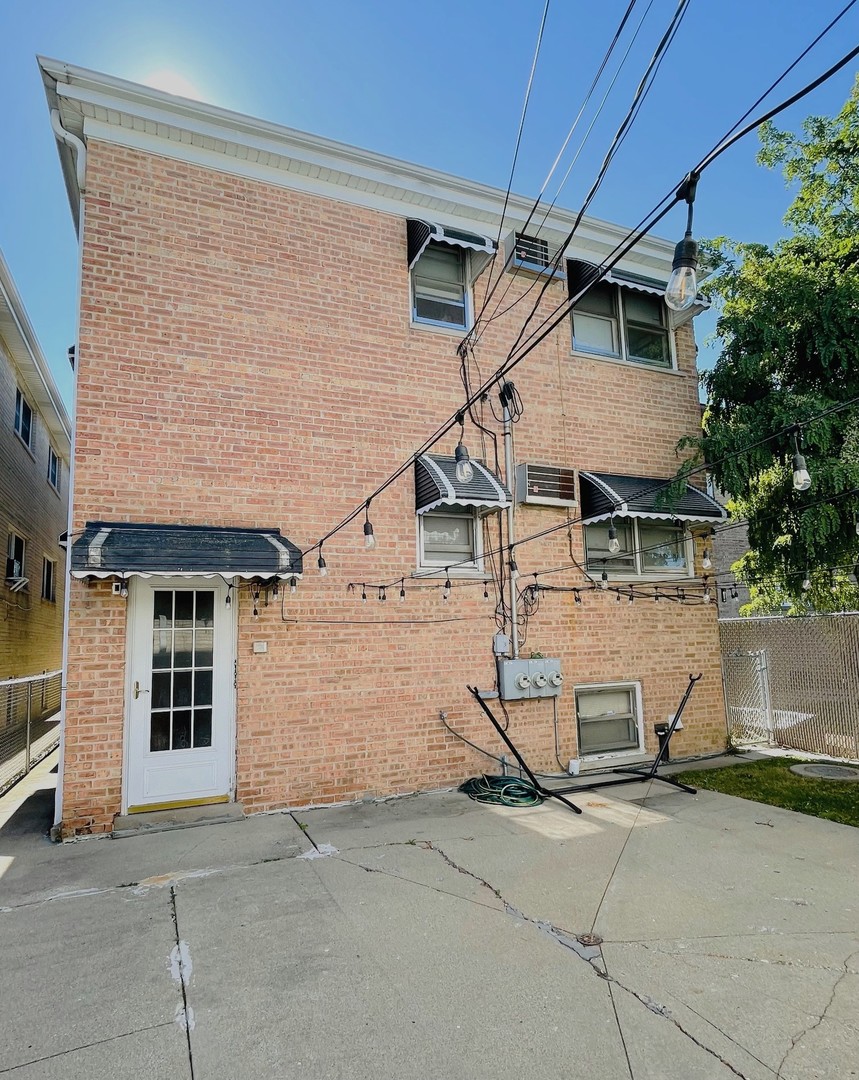 6614 West Devon Avenue Chicago, IL 60631 - Photo 21 of 21 a view of a house with garage