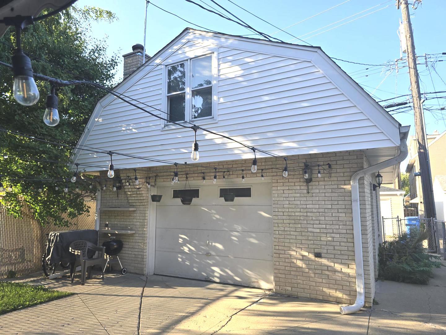 6614 West Devon Avenue Chicago, IL 60631 - Photo 3 of 21 a view of a house with brick walls