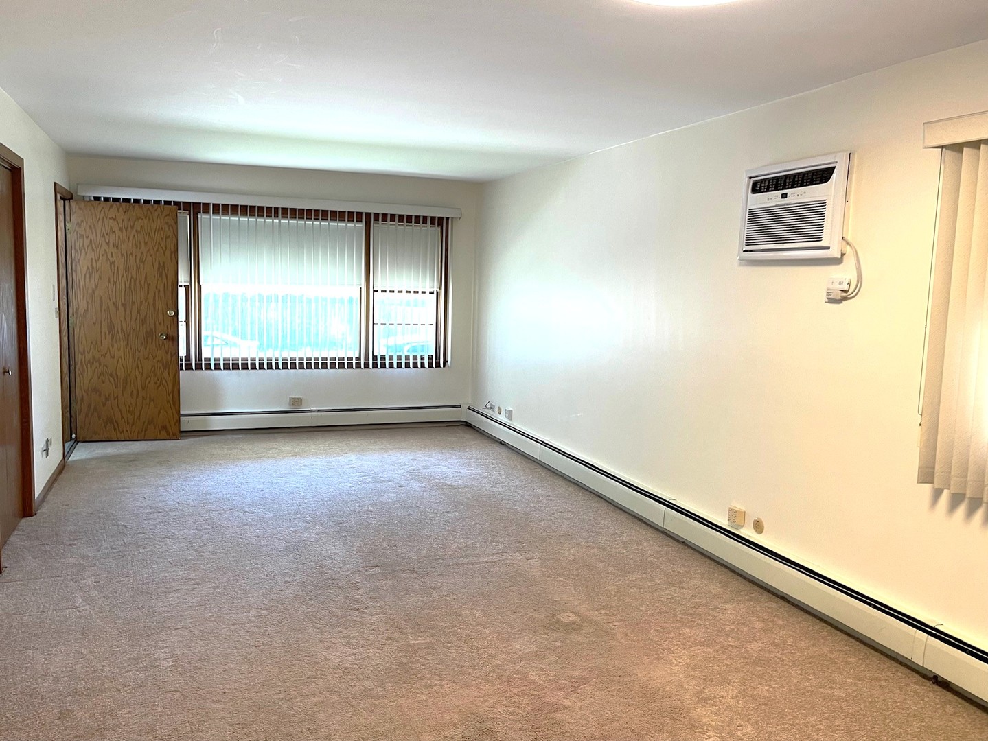 6614 West Devon Avenue Chicago, IL 60631 - Photo 4 of 21 an empty room with a empty space and windows