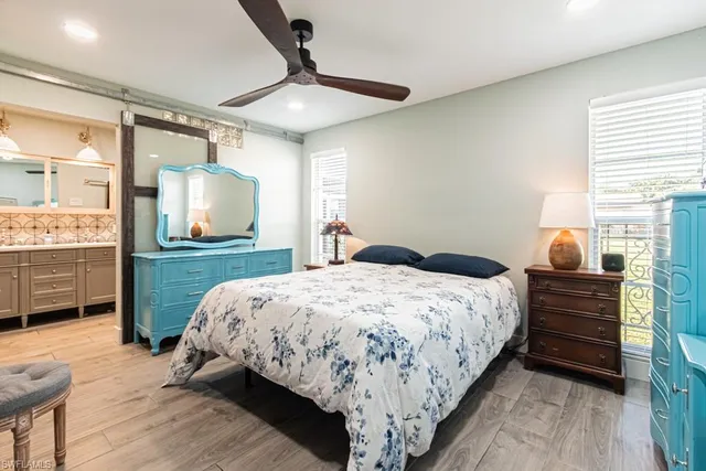 a bedroom with a bed and a table