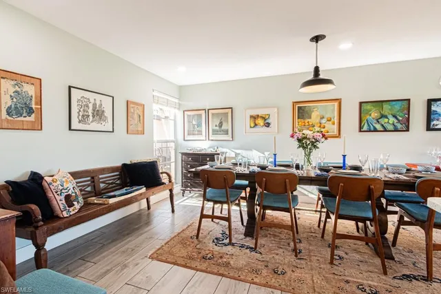 a living room with furniture a rug and a window