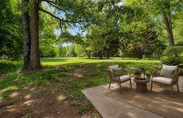 4110 Ridgebrook Bend Cumming, GA 30028 - Photo 44 of 49 a view of a patio with a table chairs and a yard