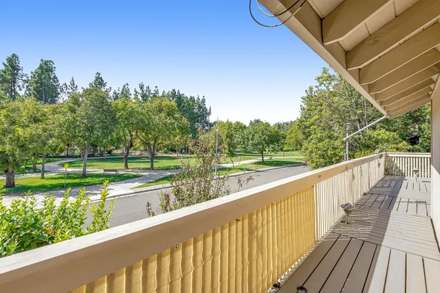 a view of deck and yard with seating space