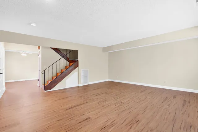 a kitchen with stainless steel appliances granite countertop a refrigerator and a stove