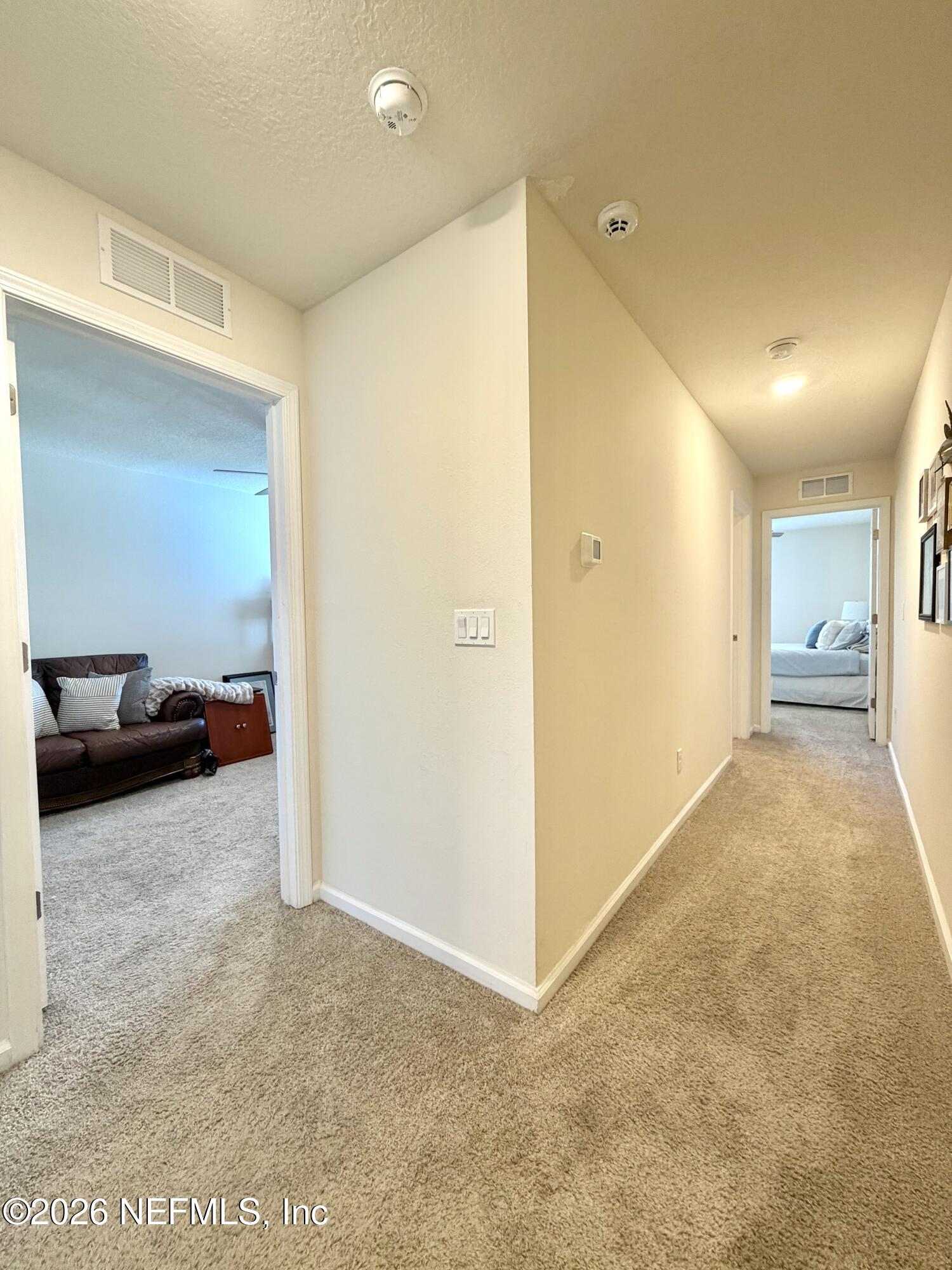 845 Observatory Parkway Jacksonville, FL 32218 - Photo 11 of 42 a view of hallway with a livingroom and a couch