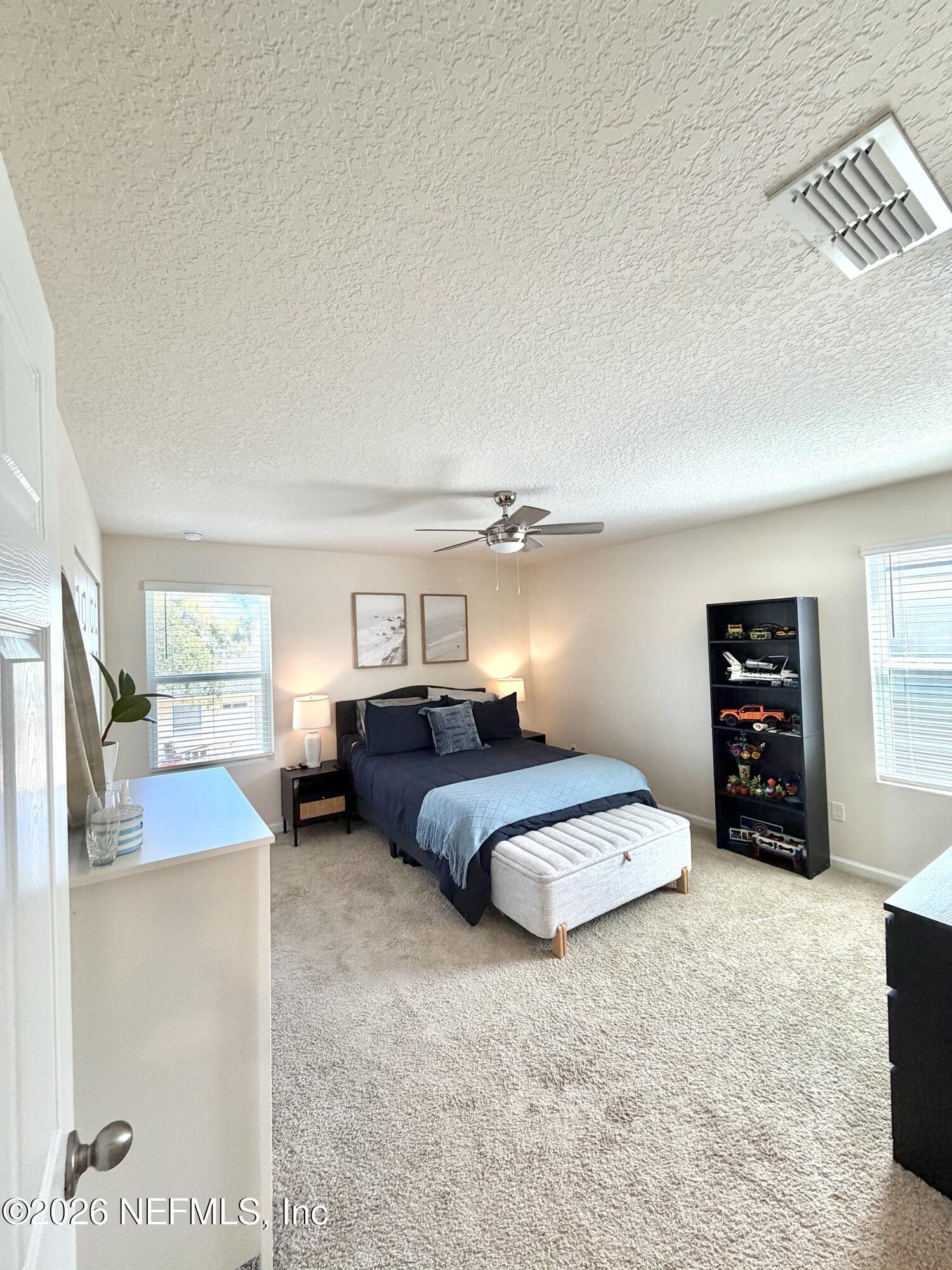 845 Observatory Parkway Jacksonville, FL 32218 - Photo 16 of 42 a bedroom with furniture and a couch