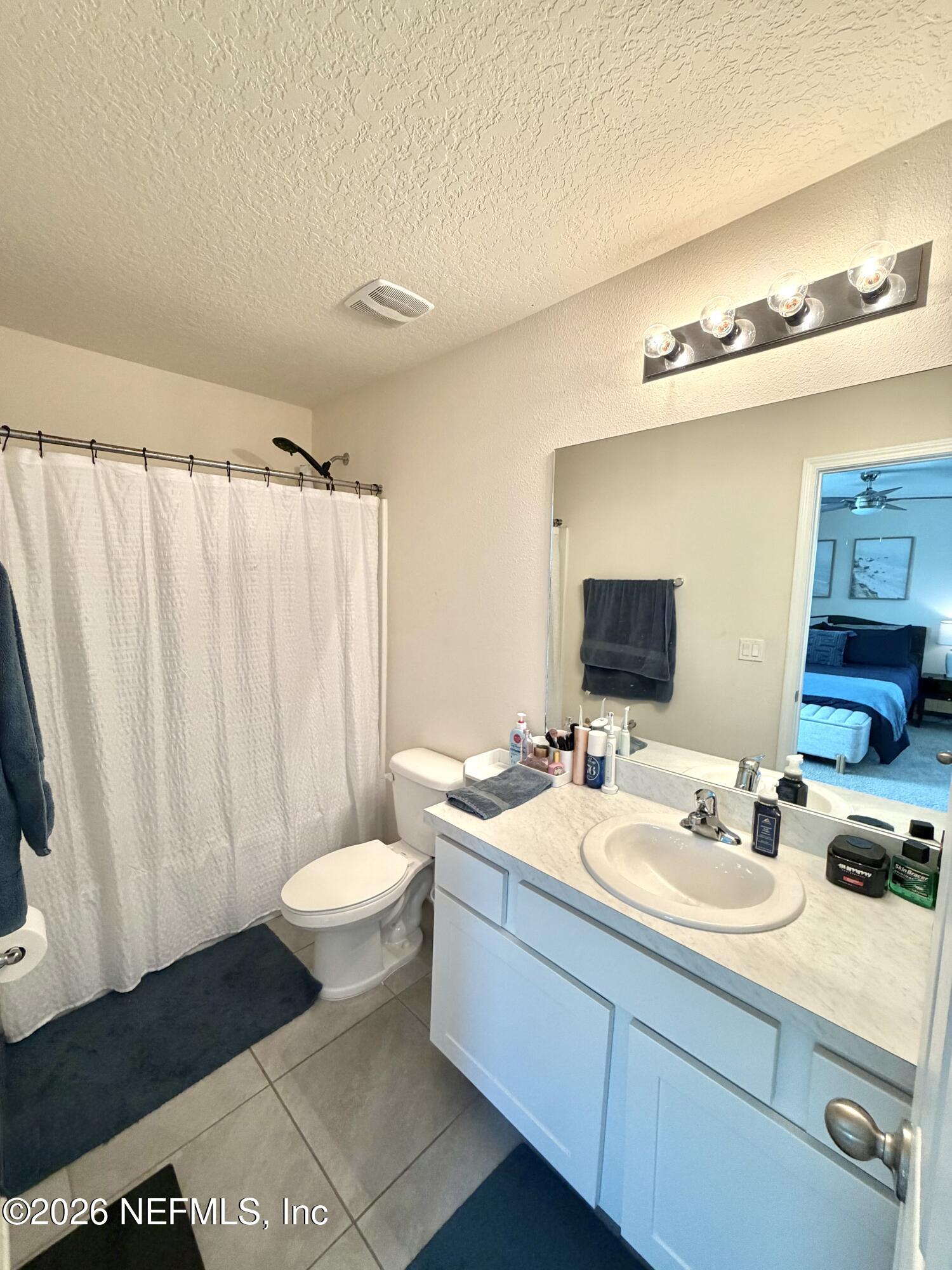 845 Observatory Parkway Jacksonville, FL 32218 - Photo 19 of 42 a bathroom with a double vanity sink and a mirror