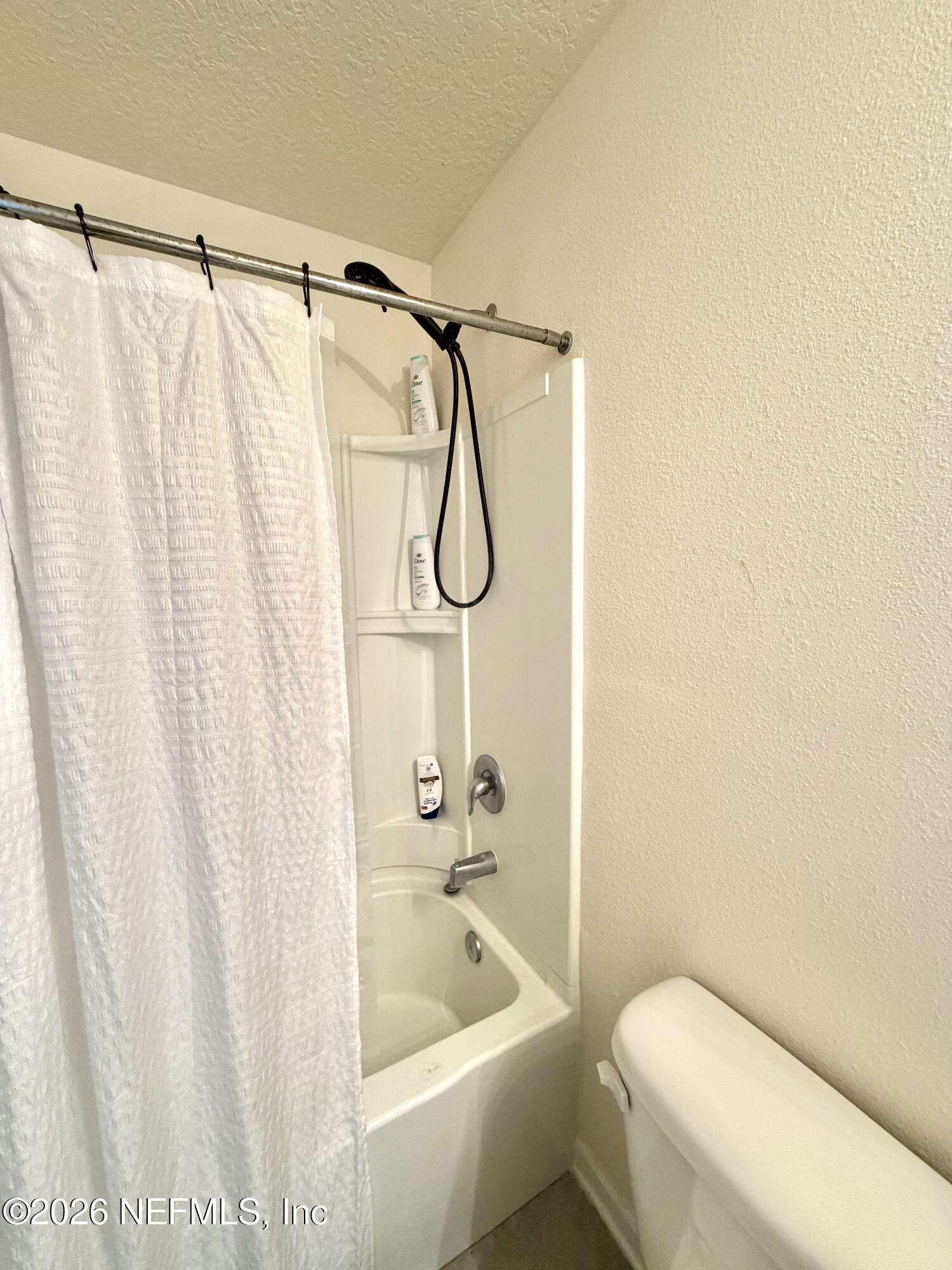 845 Observatory Parkway Jacksonville, FL 32218 - Photo 21 of 42 a white toilet sitting next to a bath tub