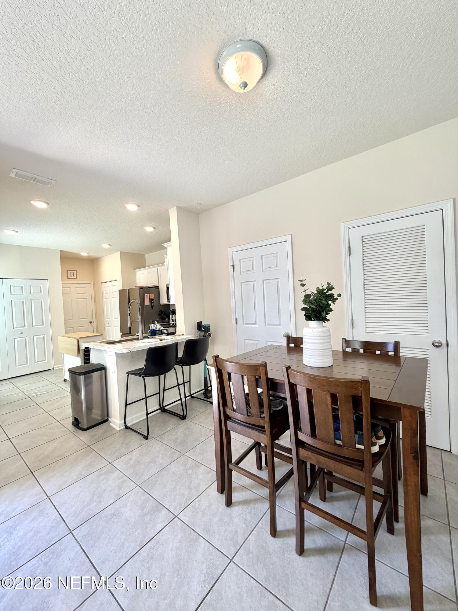 845 Observatory Parkway Jacksonville, FL 32218 - Photo 27 of 42 a view of a dining room with furniture