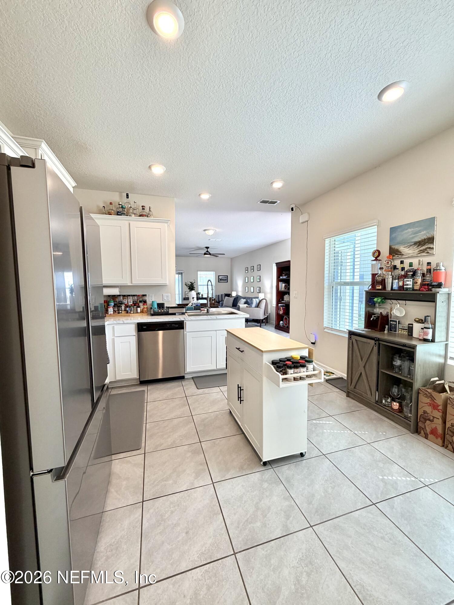 845 Observatory Parkway Jacksonville, FL 32218 - Photo 29 of 42 a kitchen with a refrigerator and a sink