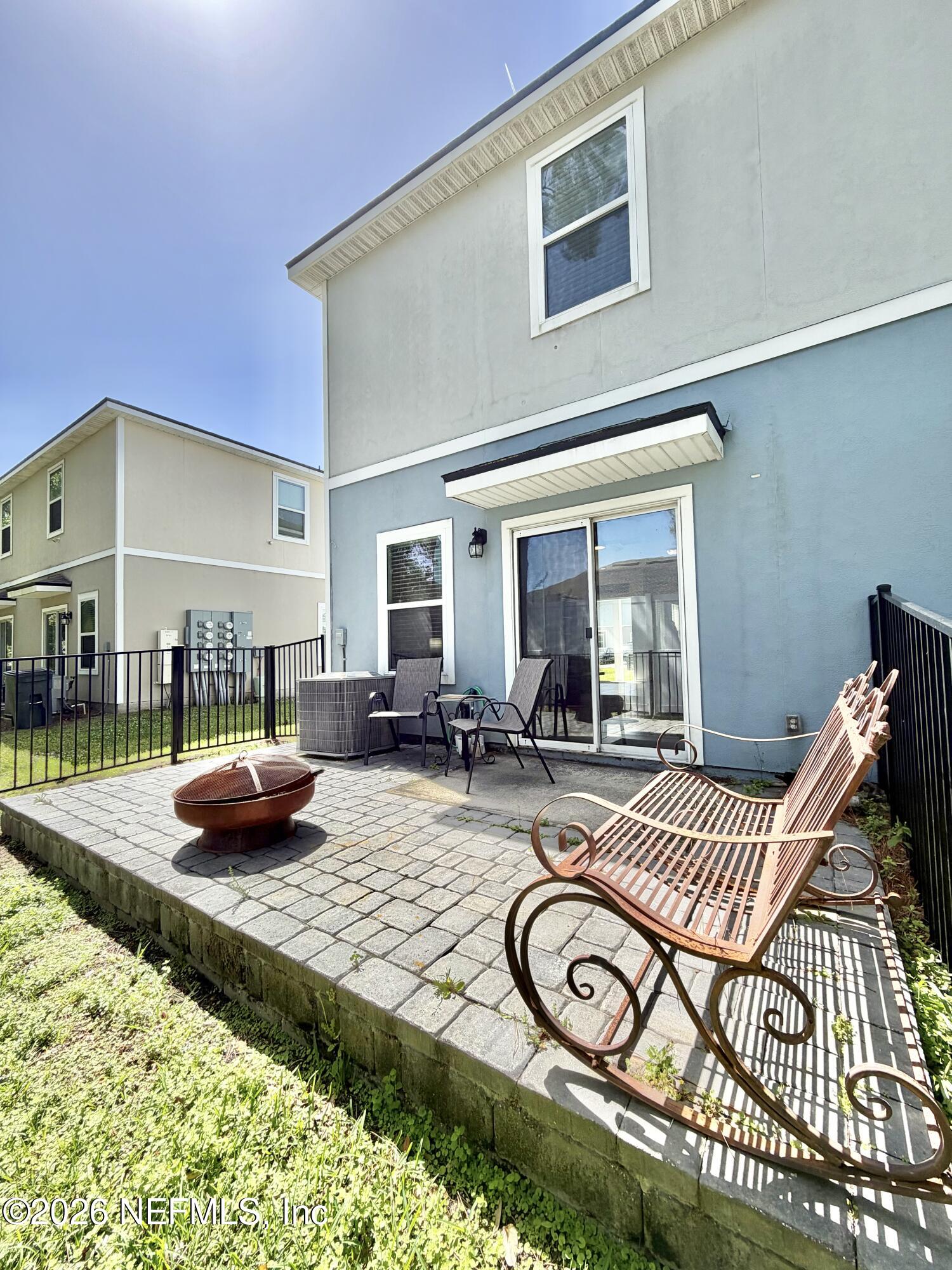 845 Observatory Parkway Jacksonville, FL 32218 - Photo 36 of 42 a view of a patio with dining table and chairs