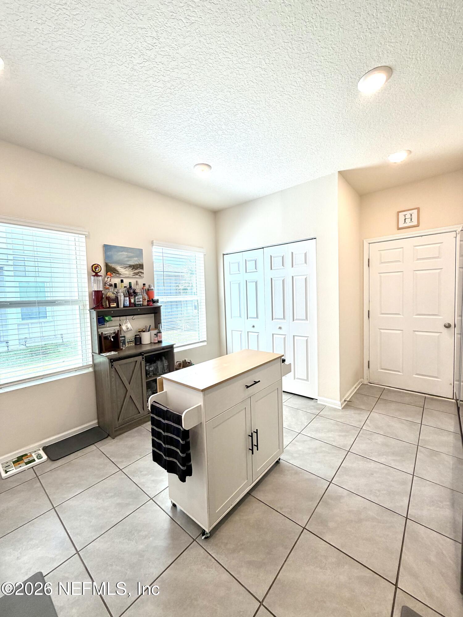 845 Observatory Parkway Jacksonville, FL 32218 - Photo 40 of 42 a kitchen with stainless steel appliances a stove a sink and a refrigerator