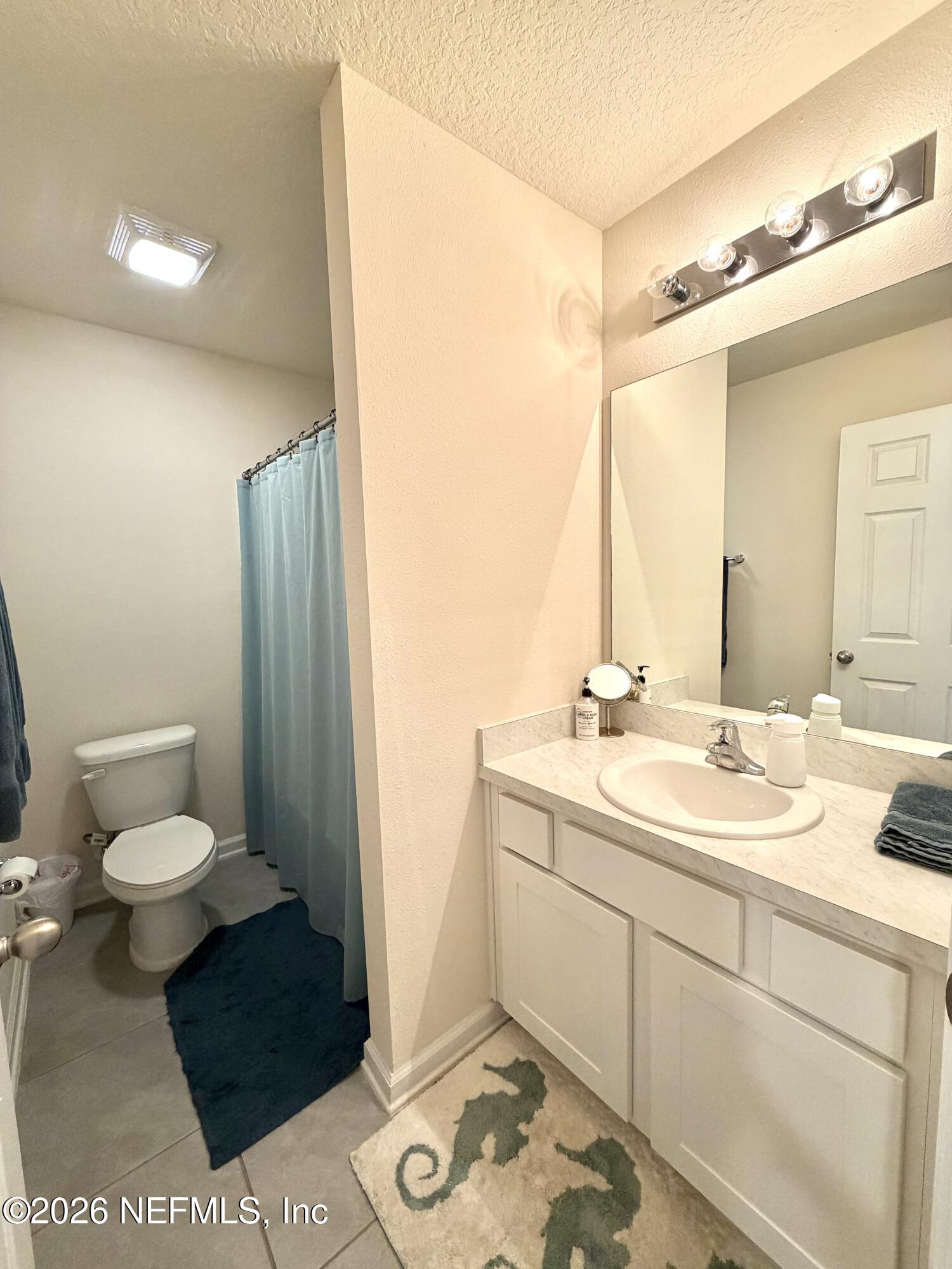845 Observatory Parkway Jacksonville, FL 32218 - Photo 4 of 42 a bathroom with a sink and a mirror
