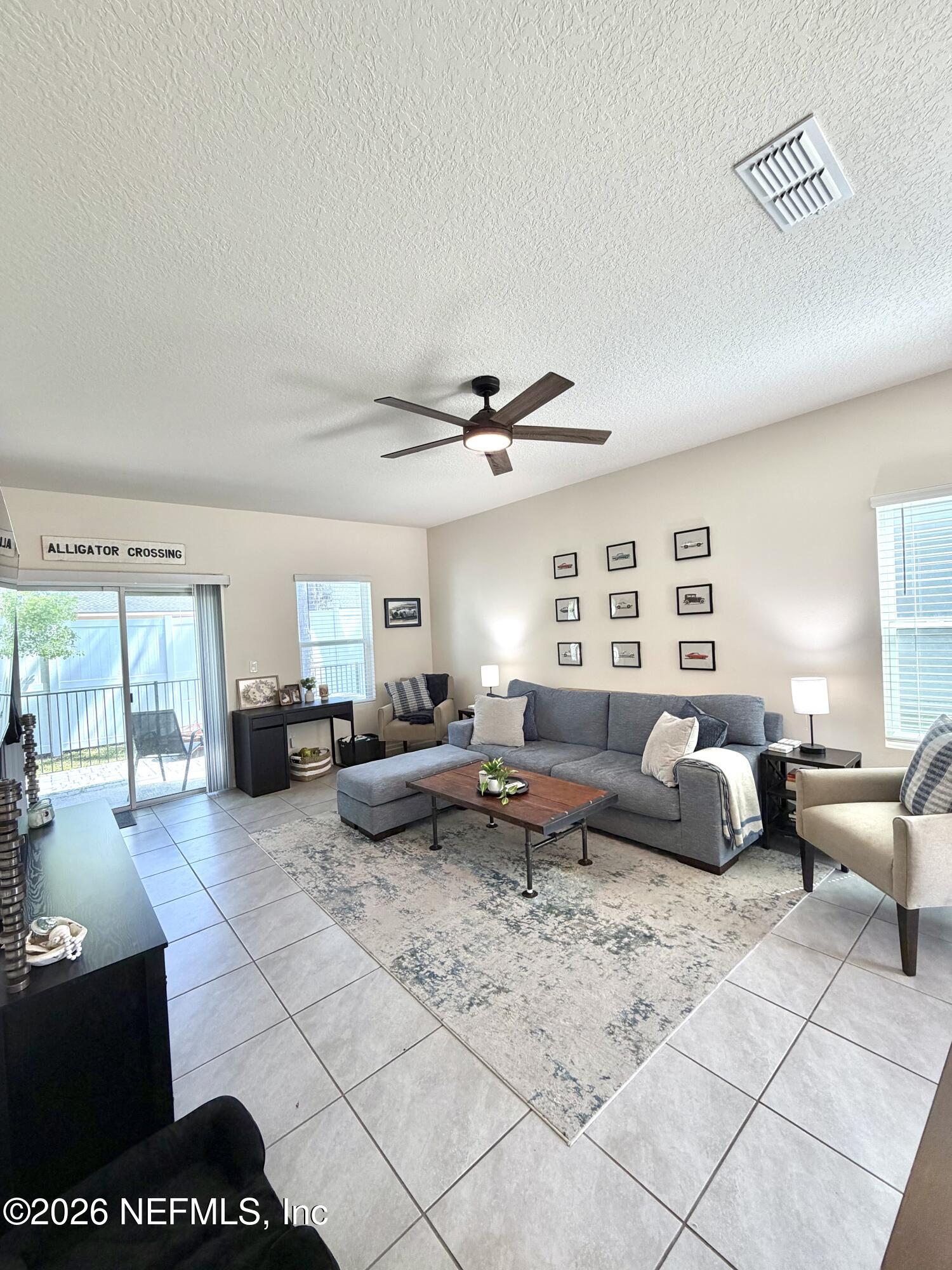 845 Observatory Parkway Jacksonville, FL 32218 - Photo 5 of 42 a living room with furniture and a large window