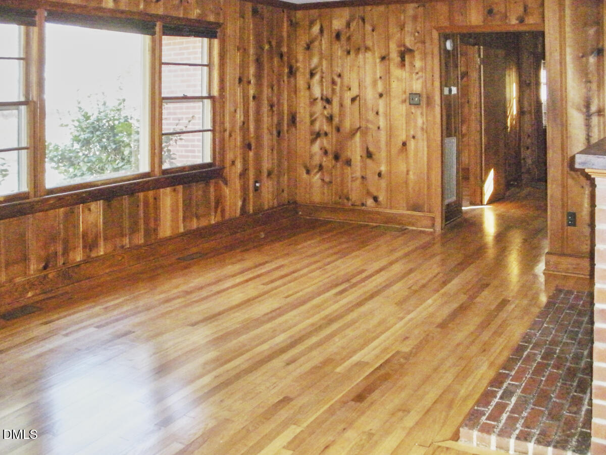 4204 Kerley Road Durham, NC 27705 - Photo 7 of 34 an empty room with wooden floor and windows