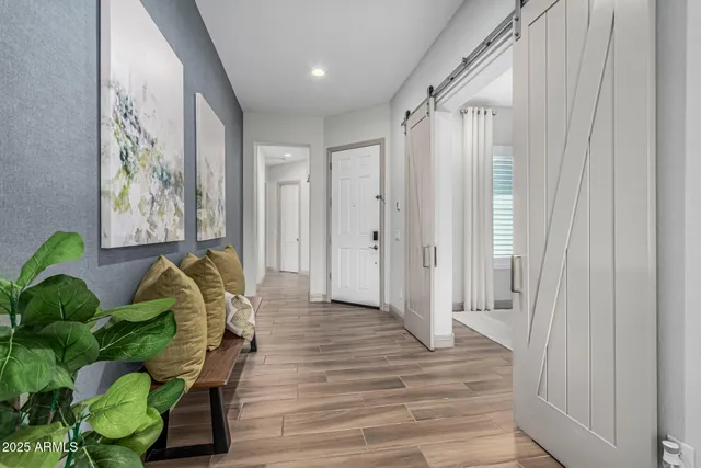 a entryway with furniture and wooden floor