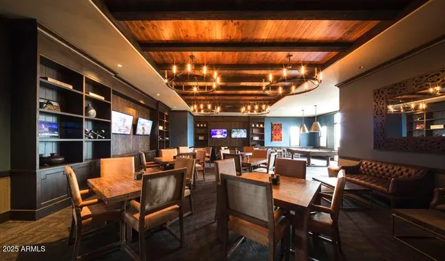 a view of a couches and a fire pit in the patio