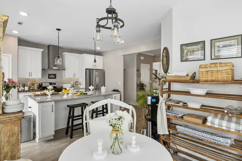 a kitchen that has a lot of cabinets in it