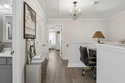 a view of a livingroom with furniture and workspace