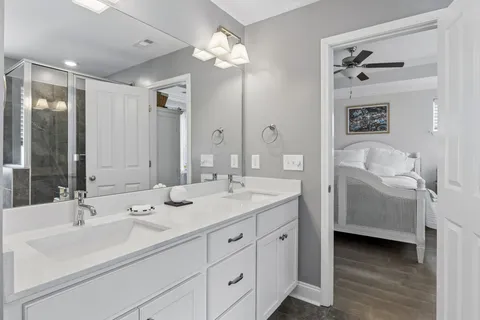 a bathroom with a double vanity sink mirror and double