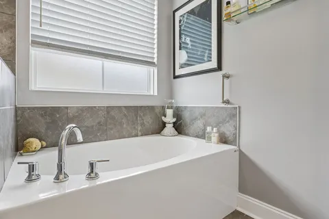 a bathroom with a sink and a window