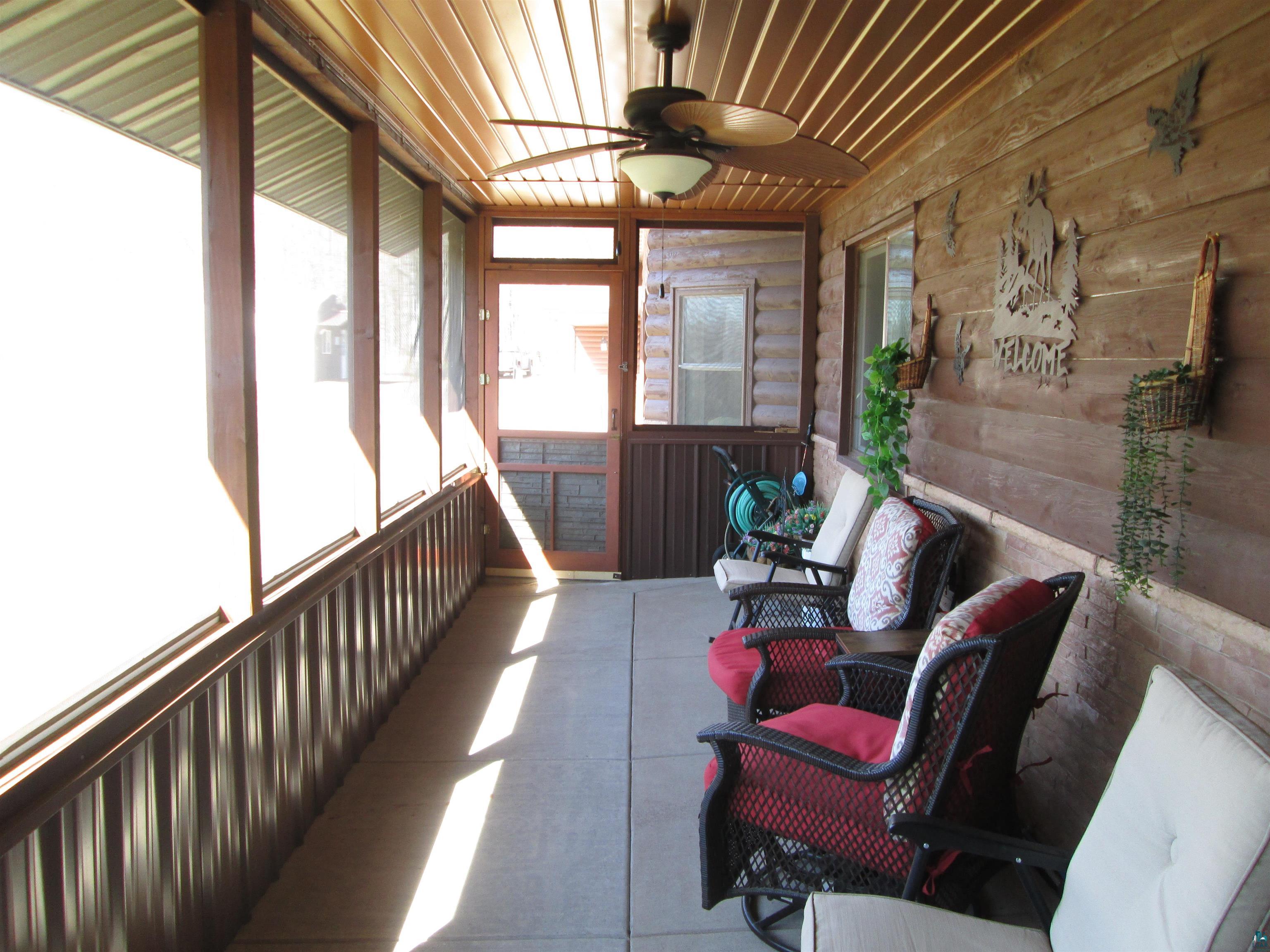 8882 Shortcut Road Lake Nebagamon, WI 54849 - Photo 4 of 47 Sunroom / solarium with a ceiling fan and plenty of natural light