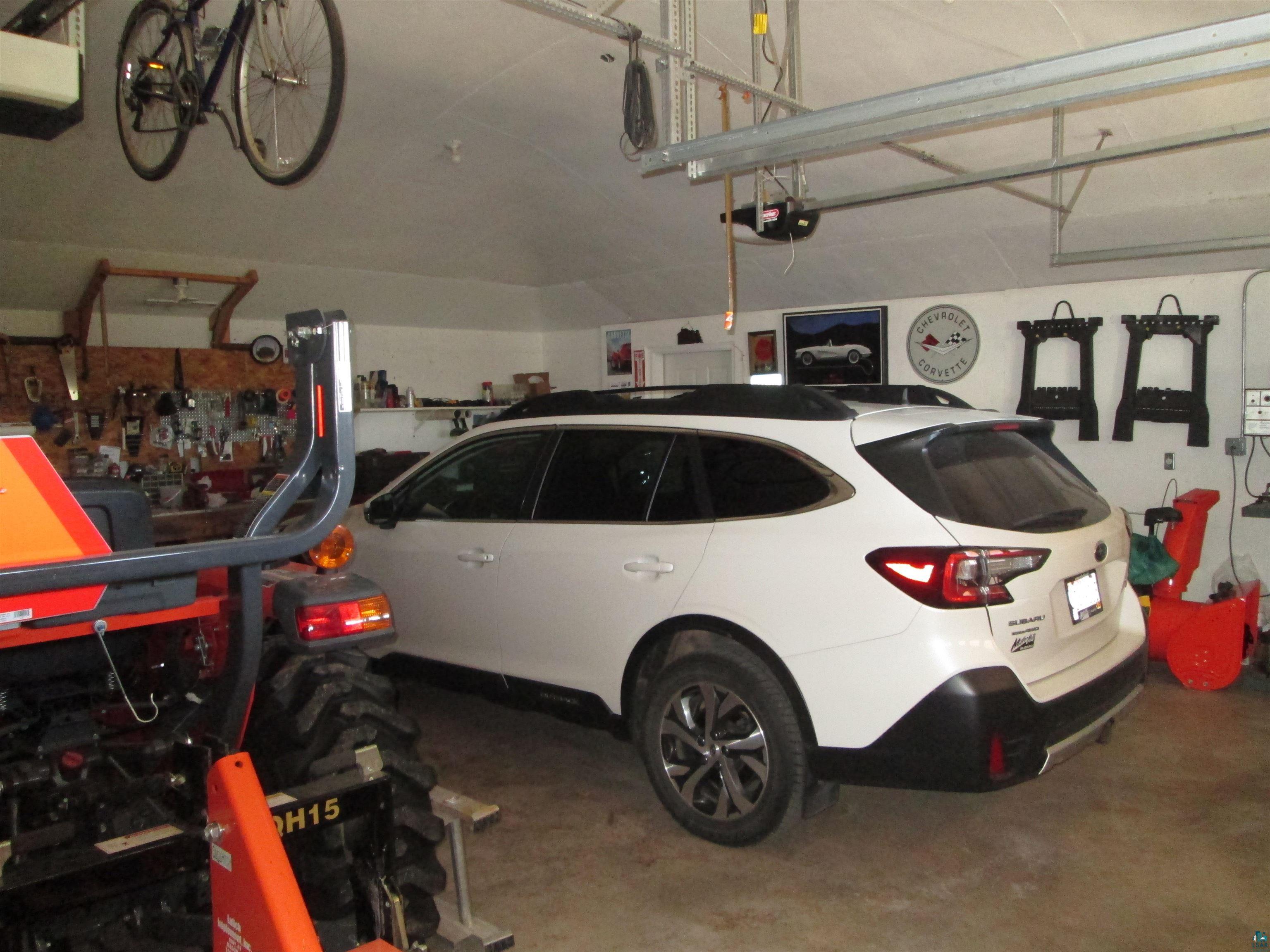 8882 Shortcut Road Lake Nebagamon, WI 54849 - Photo 42 of 47 Garage with a garage door opener