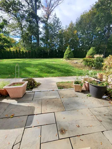 a view of a patio with a yard