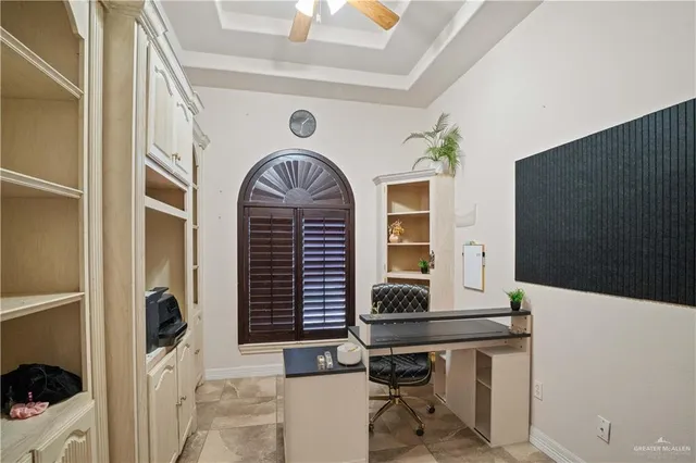 a workspace with furniture and a window