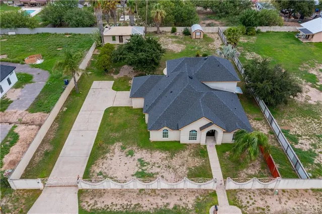 an aerial view of a house with a garden