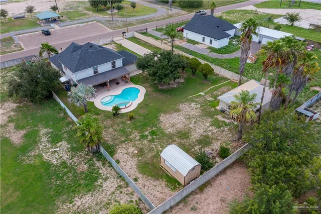 an aerial view of residential houses with outdoor space
