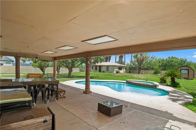 a view of a patio with a table chairs and a patio