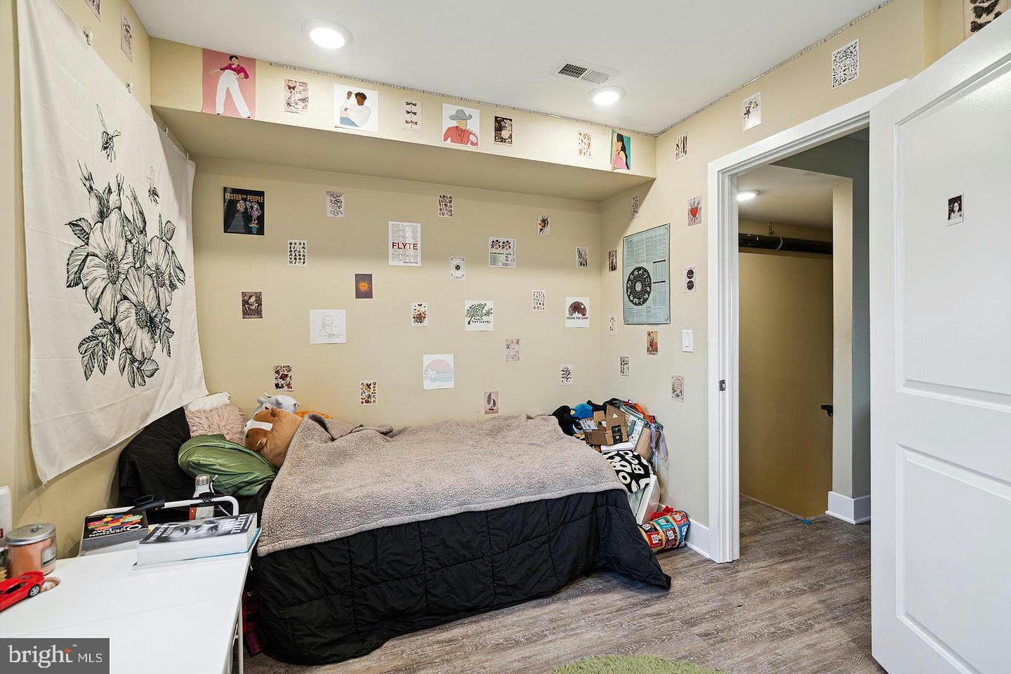 2214 North Camac Street, Unit B Philadelphia, PA 19133 - Photo 11 of 20 a bedroom with a bed dresser and a window