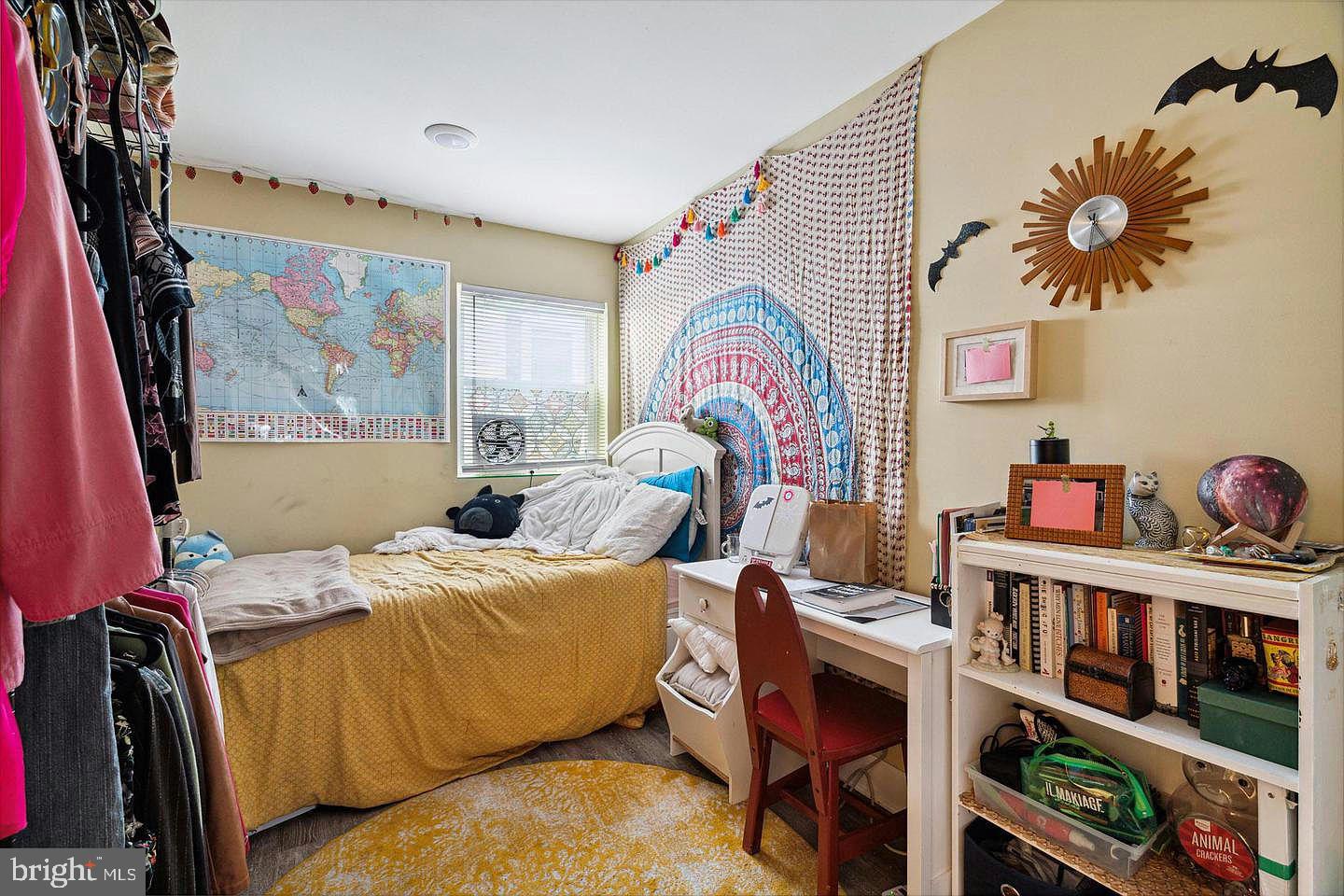 2214 North Camac Street, Unit B Philadelphia, PA 19133 - Photo 12 of 20 a bedroom with a bed and a book shelf