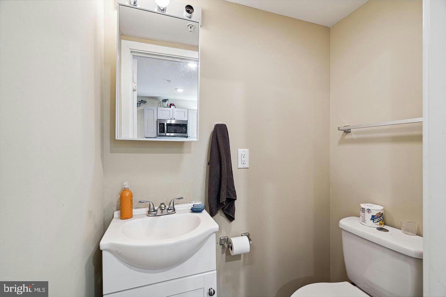 2214 North Camac Street, Unit B Philadelphia, PA 19133 - Photo 18 of 20 a bathroom with a sink mirror and toilet
