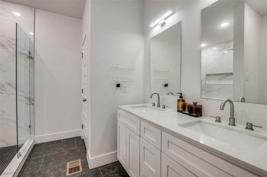 2325 Budd Street Dallas, TX 75215 - Photo 10 of 12 a bathroom with a sink and a mirror
