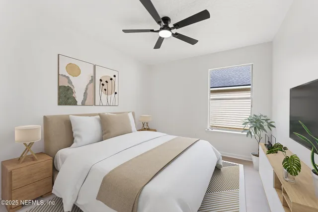 a bedroom with a bed and a flat screen tv