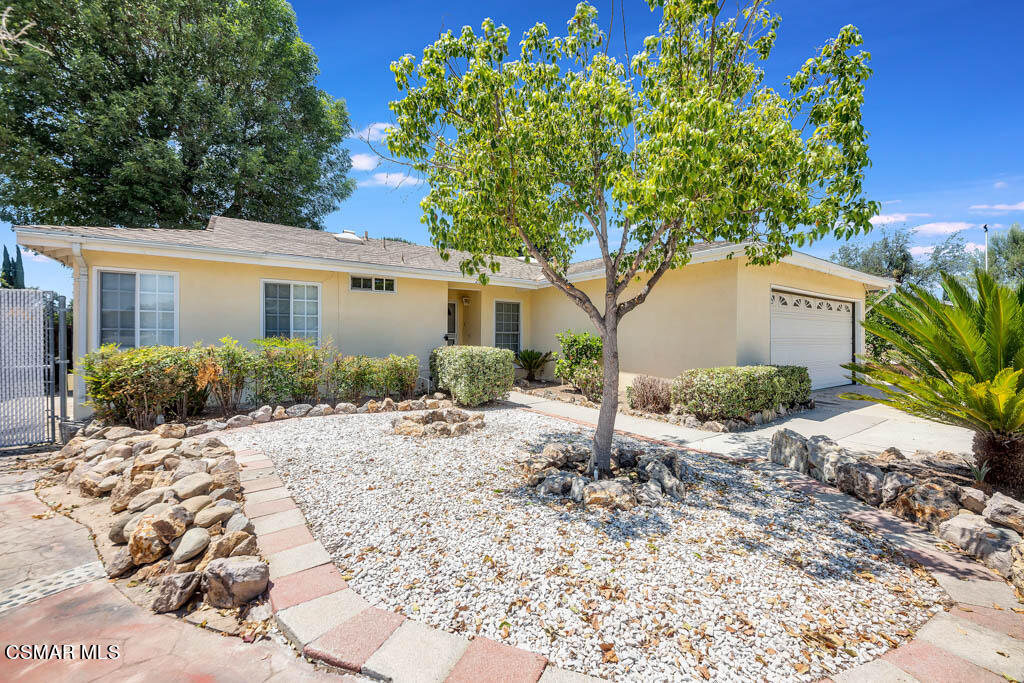 2039 Madrone Street Simi Valley, CA 93065 - Photo 1 of 35 a front view of a house with a yard