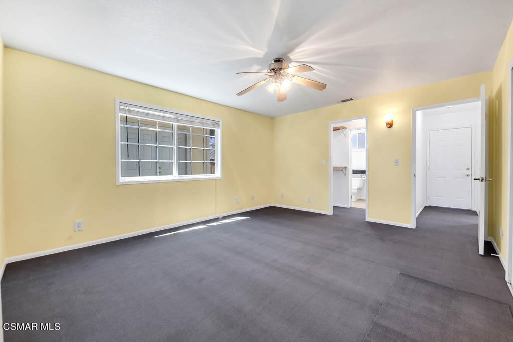 2039 Madrone Street Simi Valley, CA 93065 - Photo 13 of 35 an empty room with a ceiling fan and a window