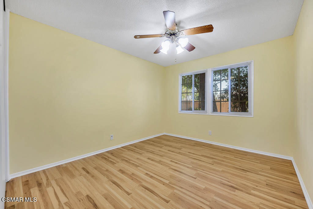 2039 Madrone Street Simi Valley, CA 93065 - Photo 14 of 35 a view of an empty room with wooden floor and a window