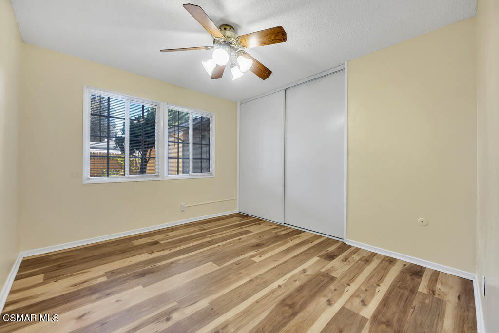 2039 Madrone Street Simi Valley, CA 93065 - Photo 17 of 35 a view of a livingroom with a ceiling fan and wooden floor