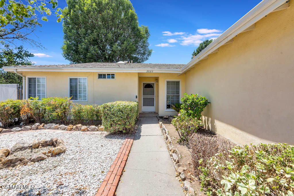2039 Madrone Street Simi Valley, CA 93065 - Photo 2 of 35 a front view of house with yard