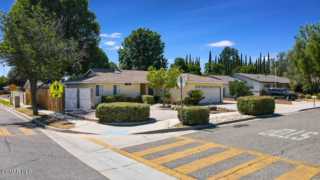 2039 Madrone Street Simi Valley, CA 93065 - Photo 34 of 35 a front view of a house with a garden
