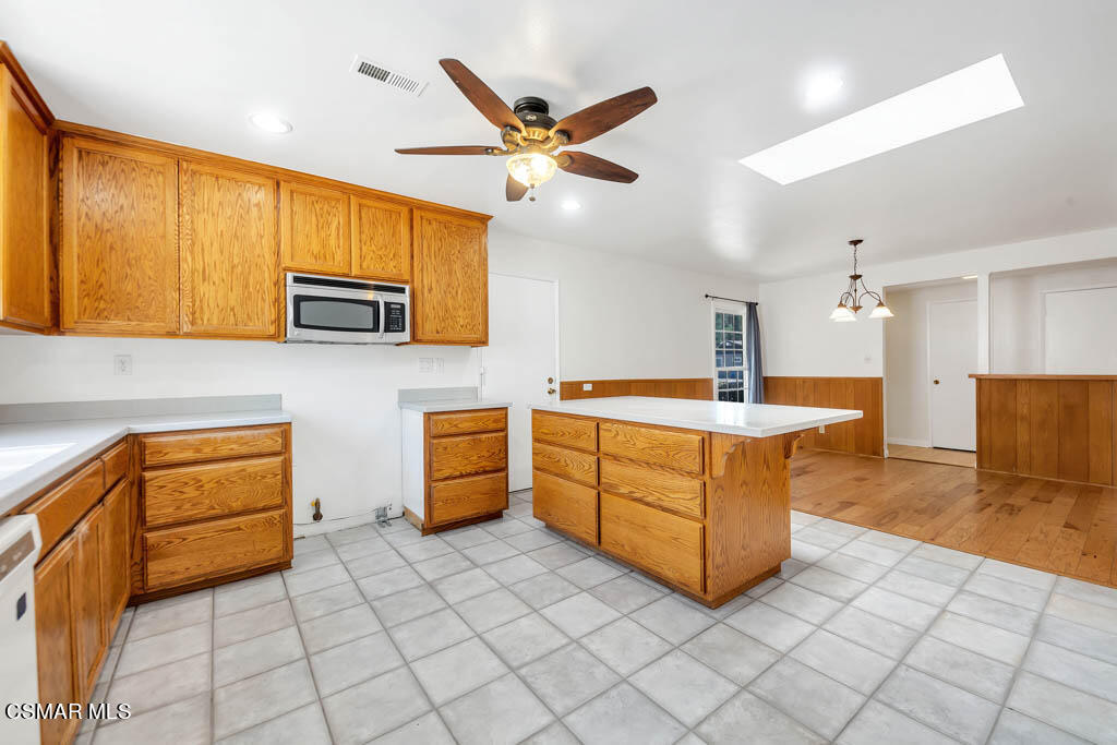 2039 Madrone Street Simi Valley, CA 93065 - Photo 7 of 35 a kitchen with stainless steel appliances granite countertop a sink and cabinets